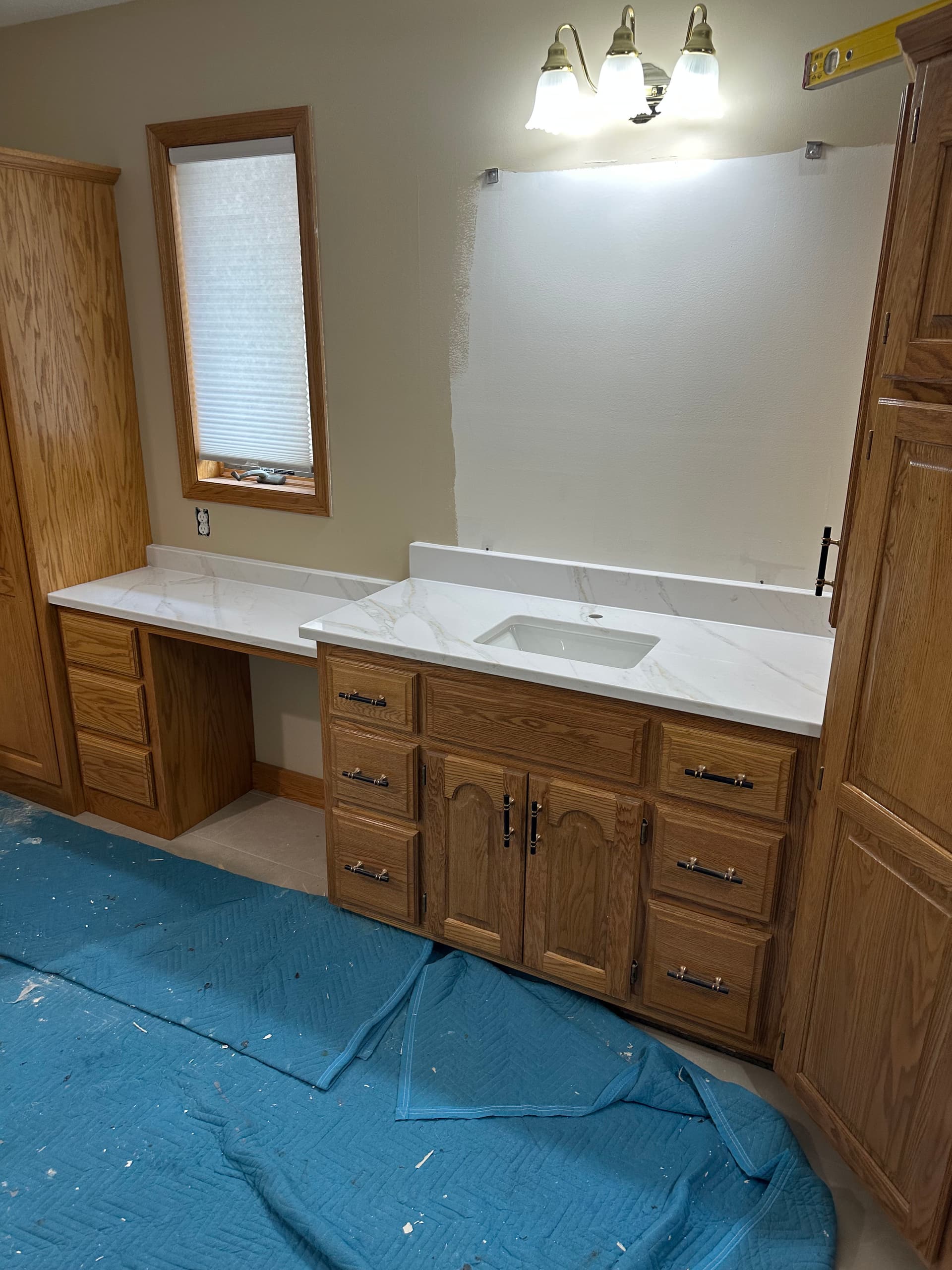 Old Tub Space Converted Into Custom Bathroom Cabinet Storage image
