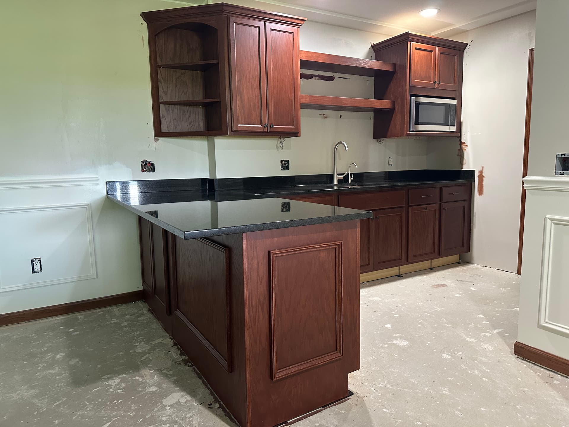 Stained Cabinets and New Countertops Make This Kitchen Pop image