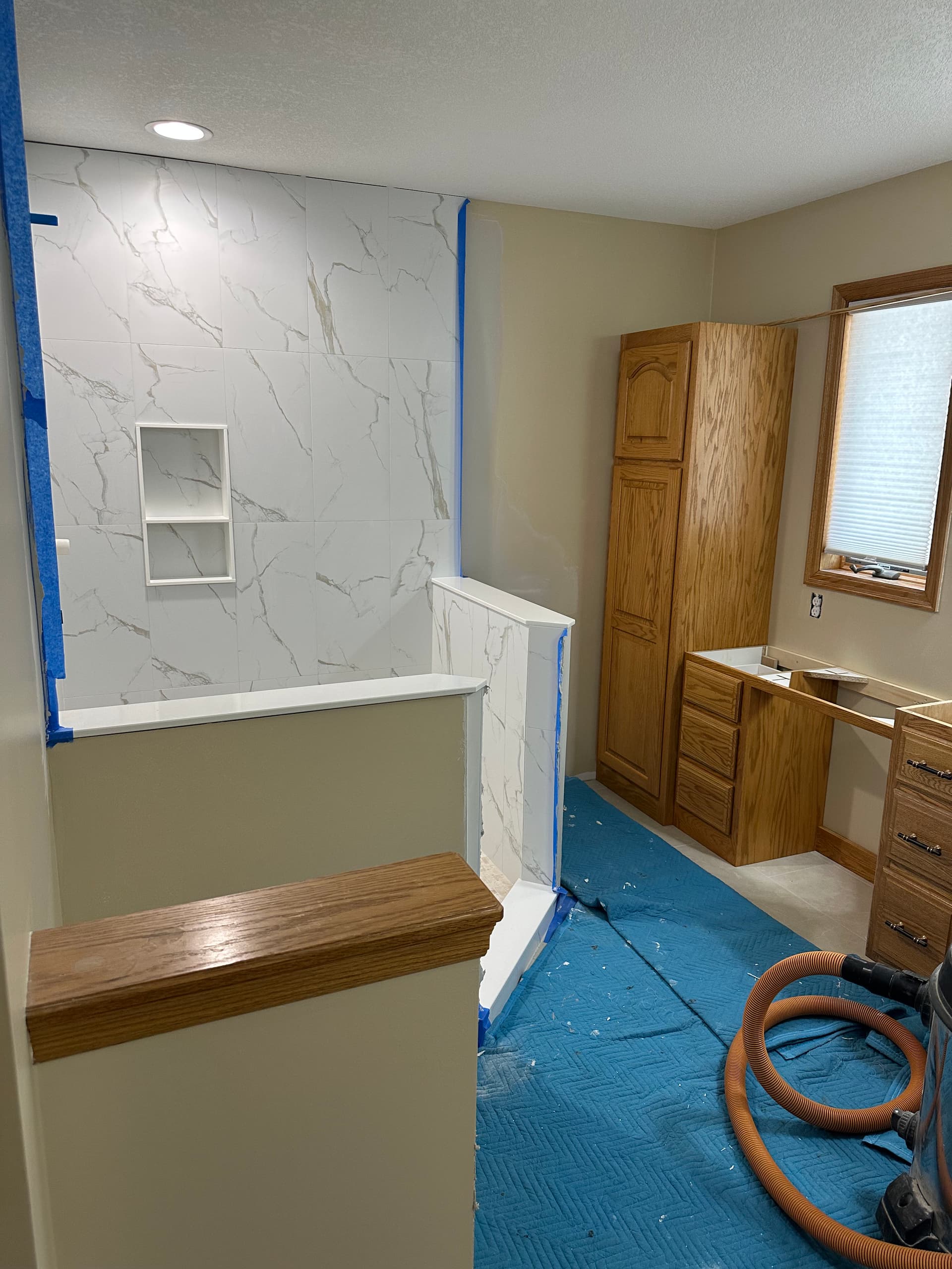 Bathroom Remodel in Progress - Tile Shower and Cabinets Taking Shape image